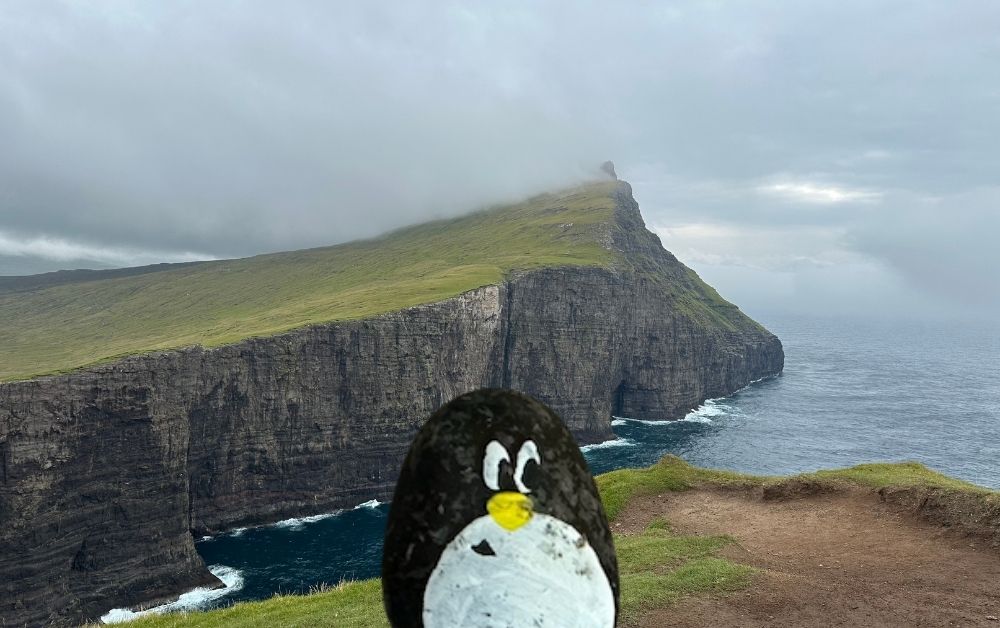 Hand-painted penguin stone #528 hidden at Traelanipa, Vagar Island, Faroe Islands (photo 1 of 5)