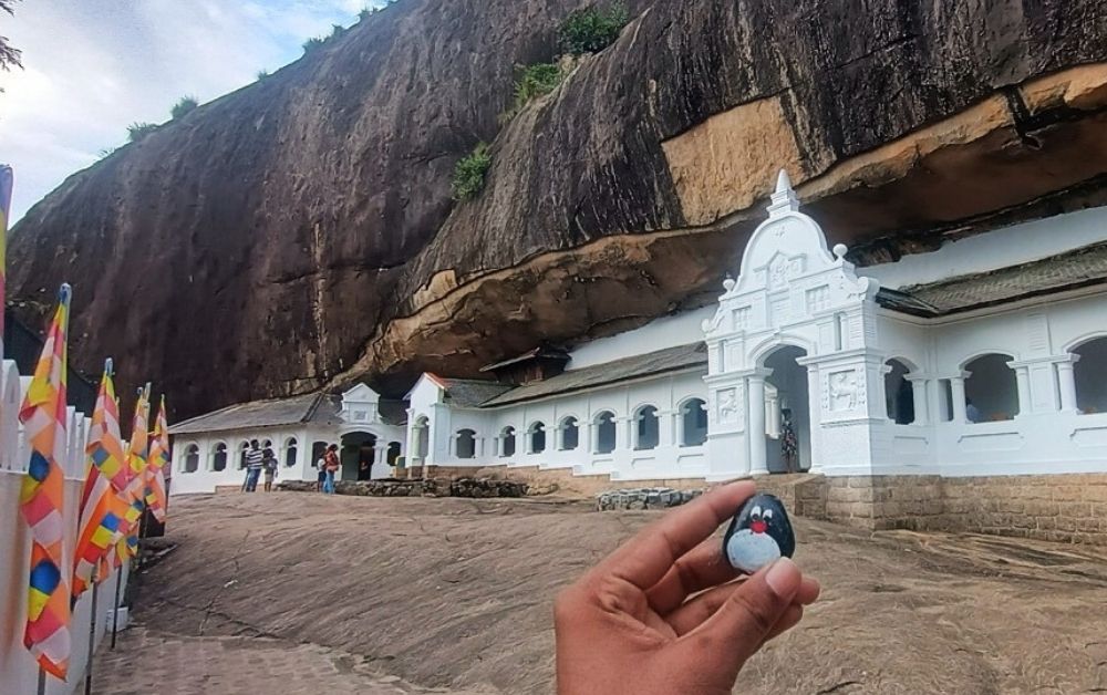 Hand-painted penguin stone #457 hidden at Dambulla Cave Temple, Dambulla, Sri Lanka (photo 1 of 5)