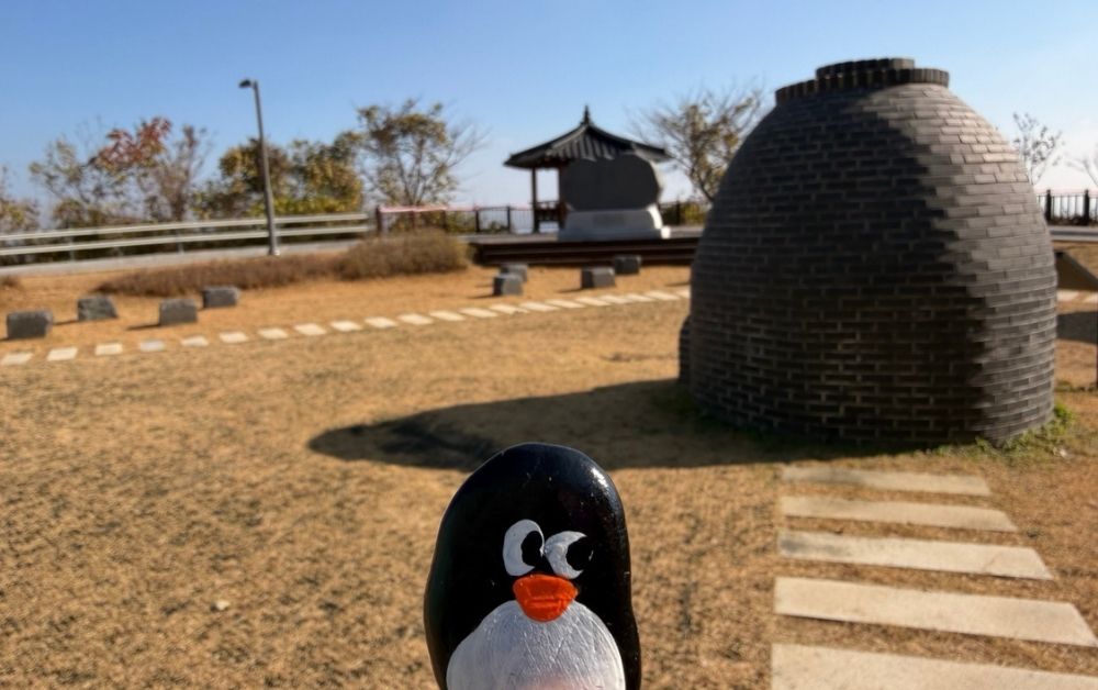 Hand-painted penguin stone #770 hidden at Pagoda at the Dora Observatory, DMZ, South Korea (photo 1 of 5)