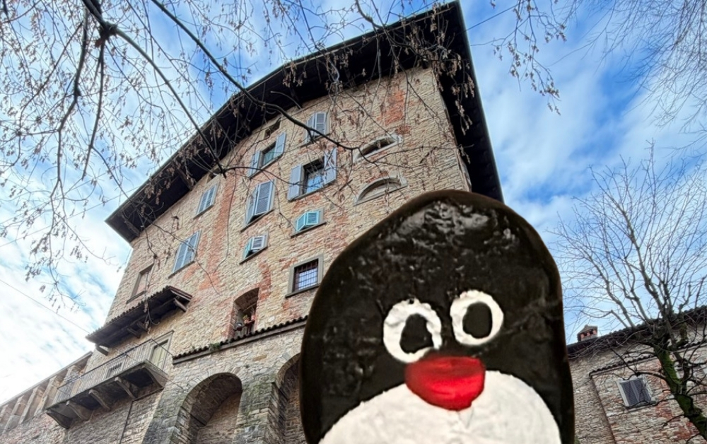 Hand-painted penguin stone #906 hidden at Antico Lavatoio, Bergamo, Italy (photo 1 of 5)