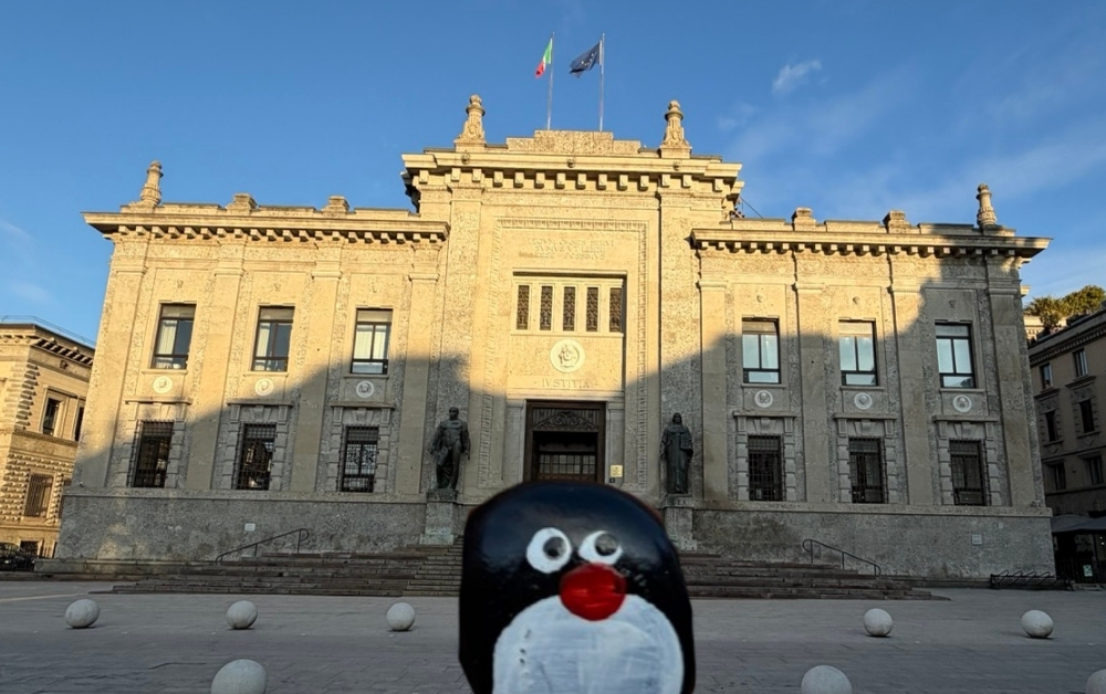 Hand-painted penguin stone #965 hidden at Giardini Comunali 'Enzo Tortora', Bergamo, Italy (photo 1 of 5)