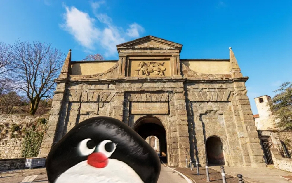 Hand-painted penguin stone #984 hidden at Saint Augustine Gate, Bergamo, Italy (photo 1 of 5)
