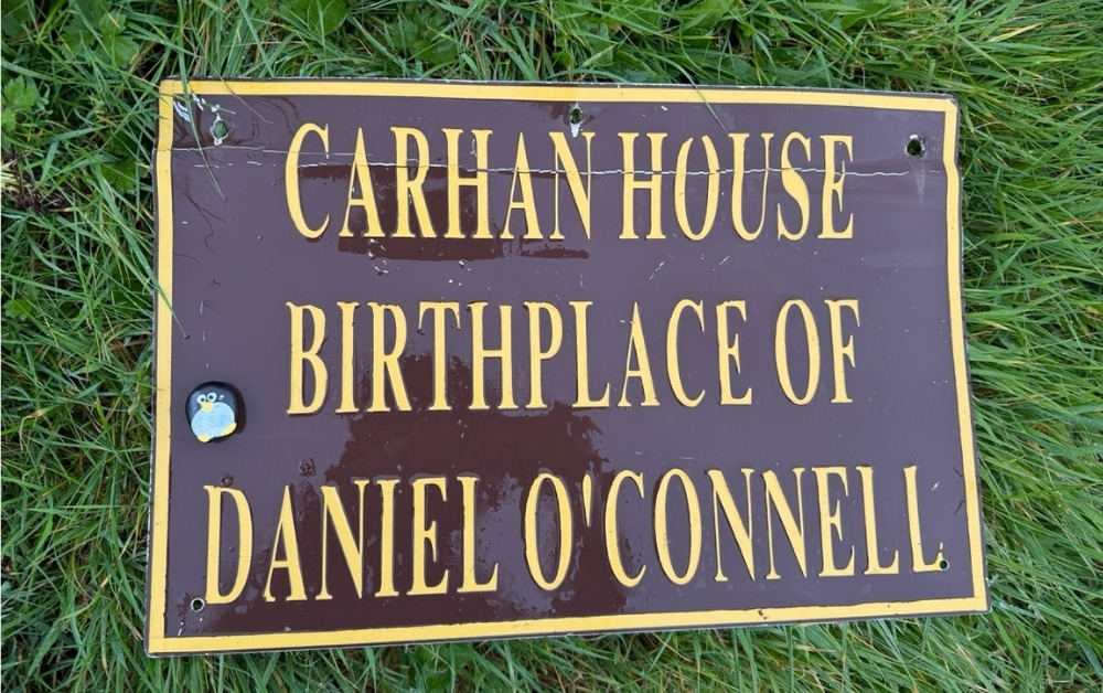 Hand-painted penguin stone #1058 hidden at Birthplace of Daniel O'Connell, Cahersiveen, Ireland (photo 1 of 5)
