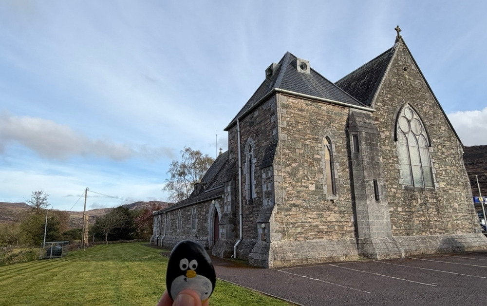 Hand-painted penguin stone #1078 hidden at St. Agatha's Catholic Church, Glenflesk, Ireland (photo 1 of 5)
