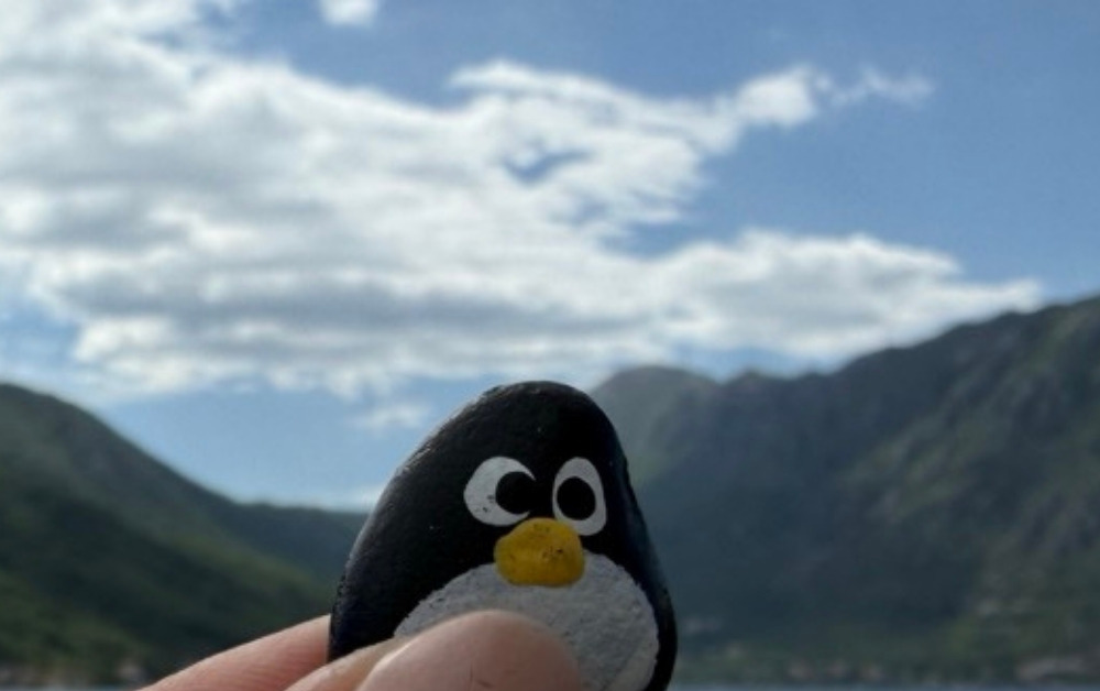Hand-painted penguin stone #1017 hidden at Stone Wall at Church of Our Lady of the Rocks, Perast, Montenegro (photo 1 of 5)