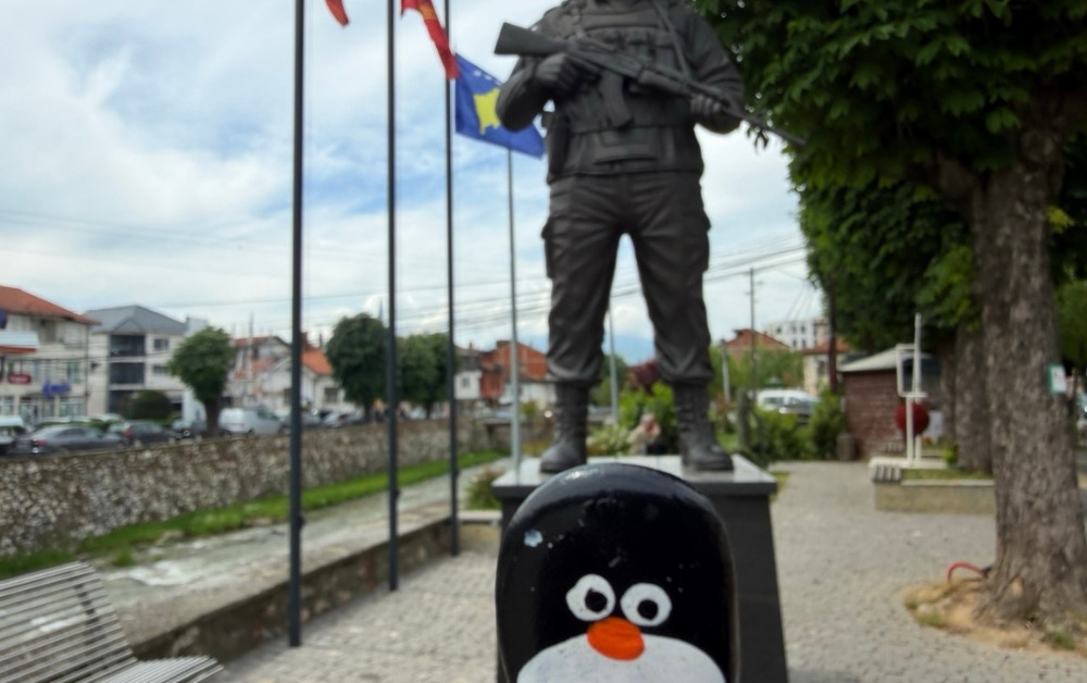 Hand-painted penguin stone #1125 hidden at Agim (Avdi) Shala monument, Prizren, Kosovo (photo 1 of 3)