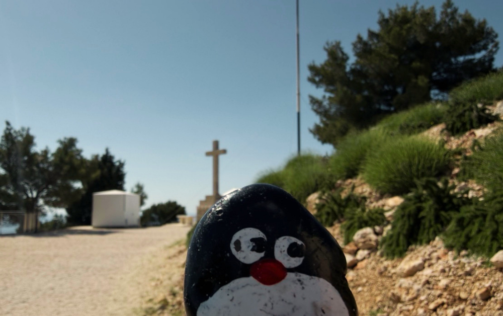 Hand-painted penguin stone #989 hidden at Rocks at Mount Srd, Dubrovnik, Croatia (photo 1 of 5)