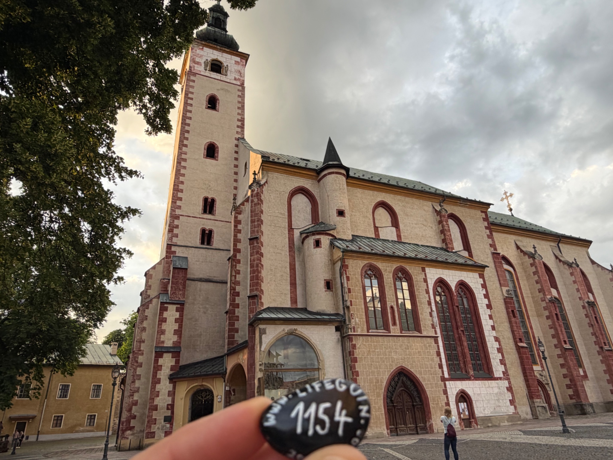Hand-painted penguin stone #1154 hidden at Church of the Assumption, Banska Bystrica, Slovakia (photo 1 of 5)