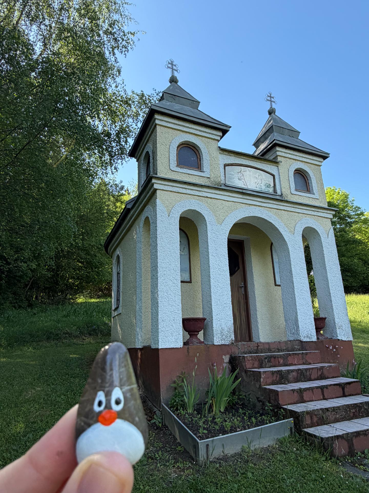Hand-painted penguin stone #1620 hidden at Chapel, Vysoka nad Kysucou, Slovakia (photo 1 of 5)