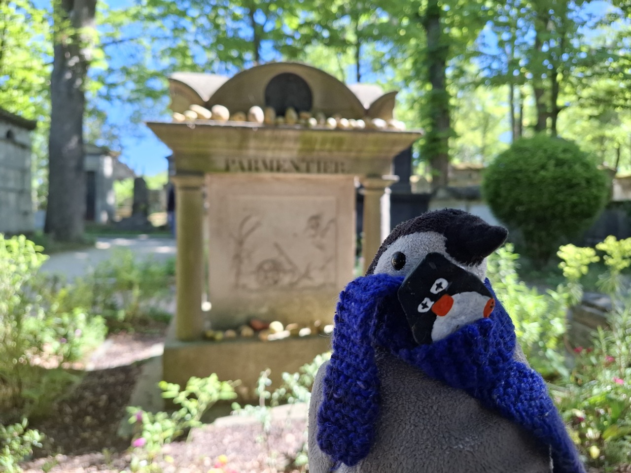 Hand-painted penguin stone #287 hidden at Pere Lachaise, Paris, France (photo 1 of 5)