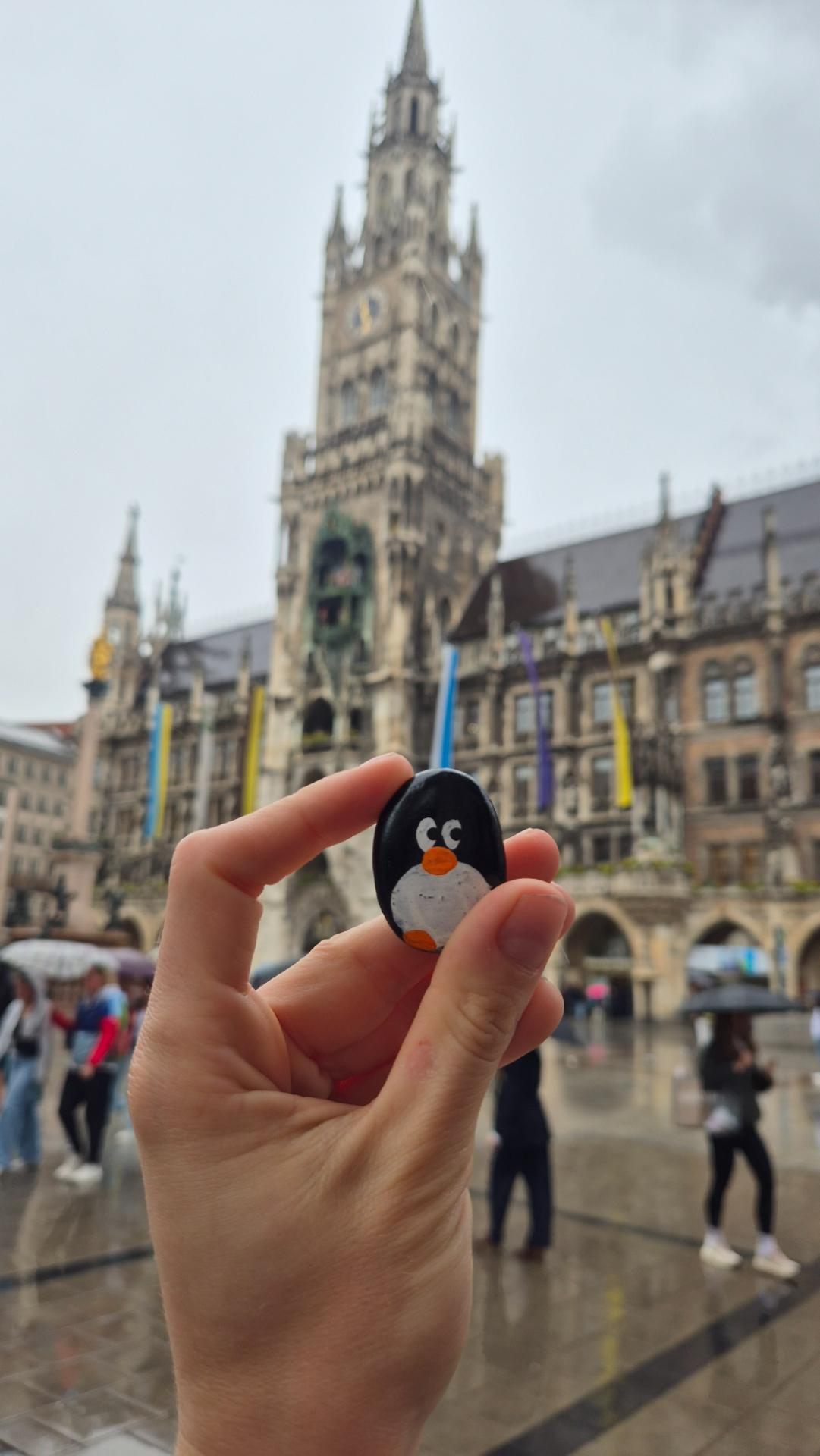 Hand-painted penguin stone #840 hidden at Marienplatz, Munich, Germany (photo 1 of 5)