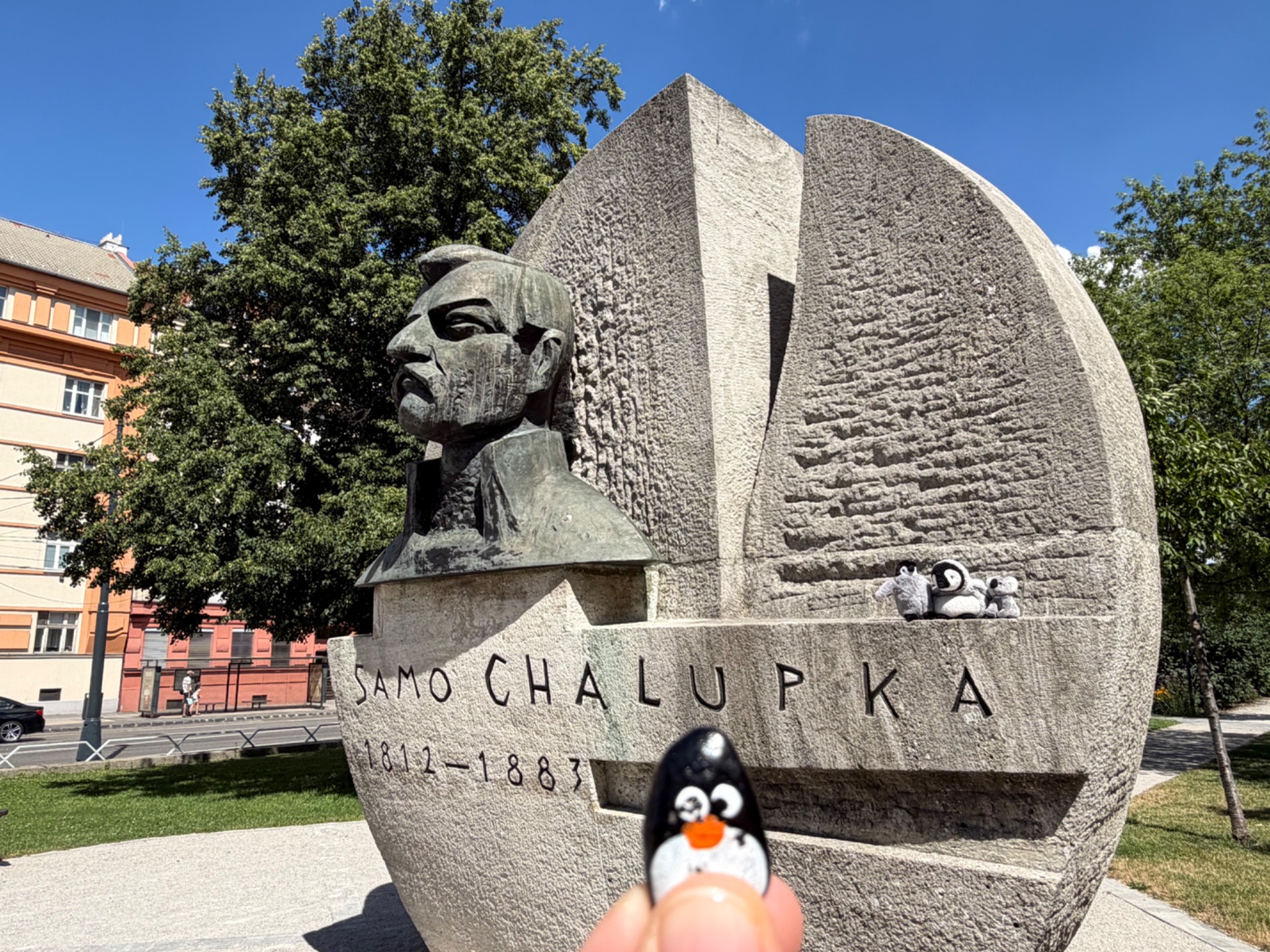 Hand-painted penguin stone #1168 hidden at Statue of Samo Chalupka, Bratislava, Slovakia (photo 1 of 4)
