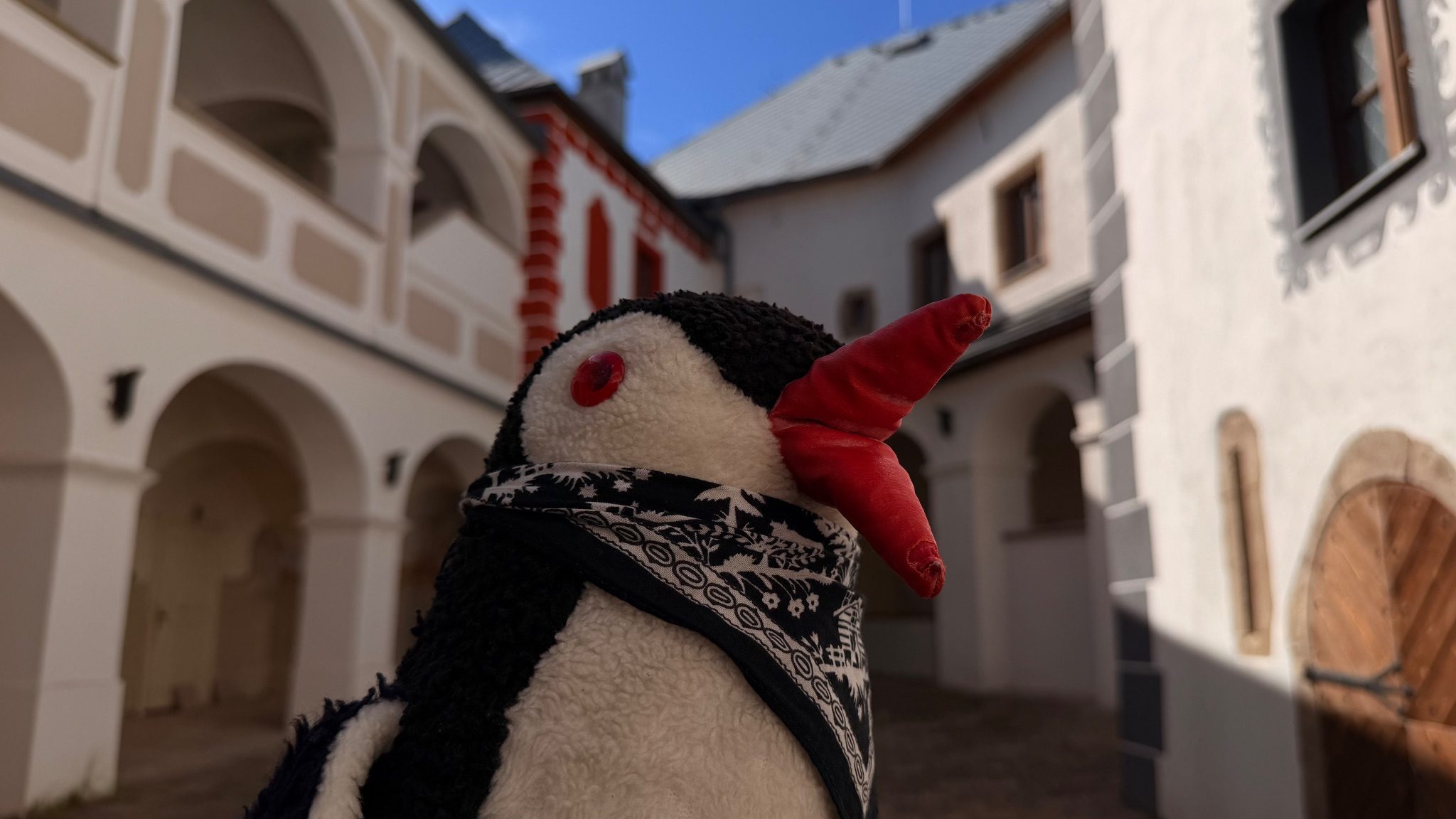 Hand-painted penguin stone #1123 hidden at Inner Courtyard of Lupca Castle, Slovenska Lupca, Slovakia (photo 1 of 5)