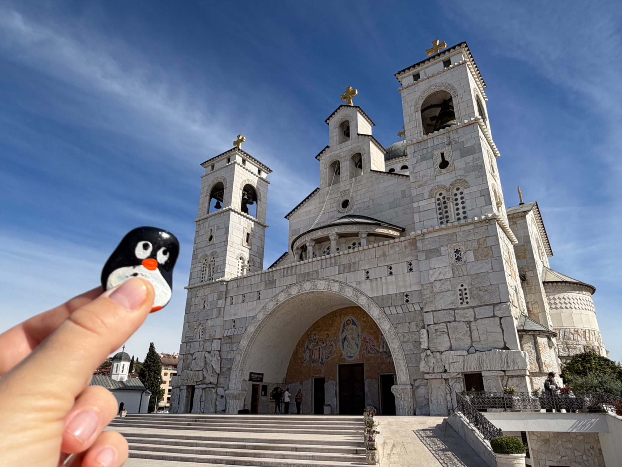Hand-painted penguin stone #1516 hidden at Temple of Christ's Resurrection, Podgorica, Montenegro (photo 1 of 5)