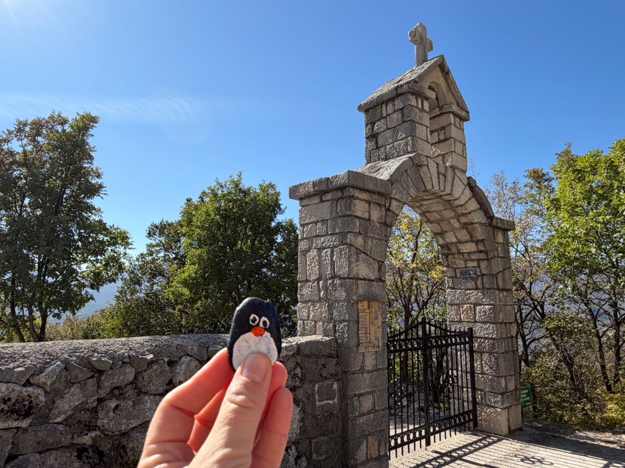 Hand-painted penguin stone #1529 hidden at Gedenkstein, Povija, Montenegro (photo 1 of 5)